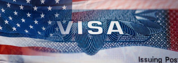 Pen and passport atop a sheet of paper that says Student Visa Application